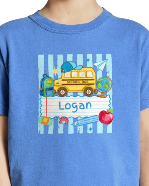 Blue t-shirt with a school-themed design and the name 'Logan' on it.
